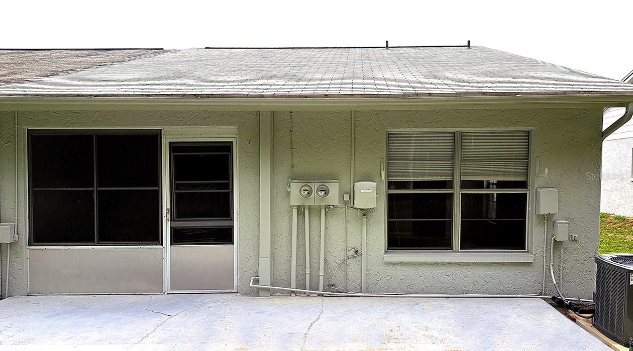 back of villa with both master bedroom and the back porch