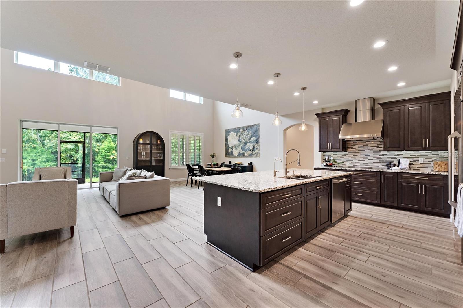 View of Kitchen/Living Room Area with Oversized Island