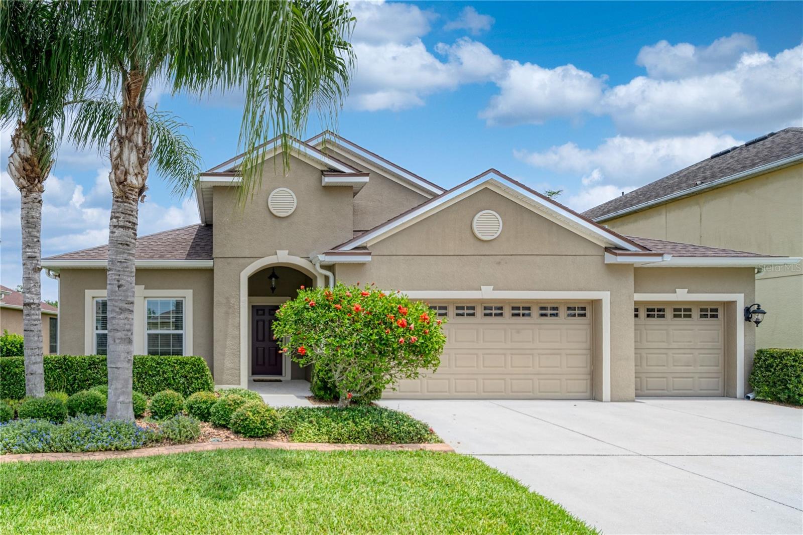 Lovely landscaping greets you to this beautiful home