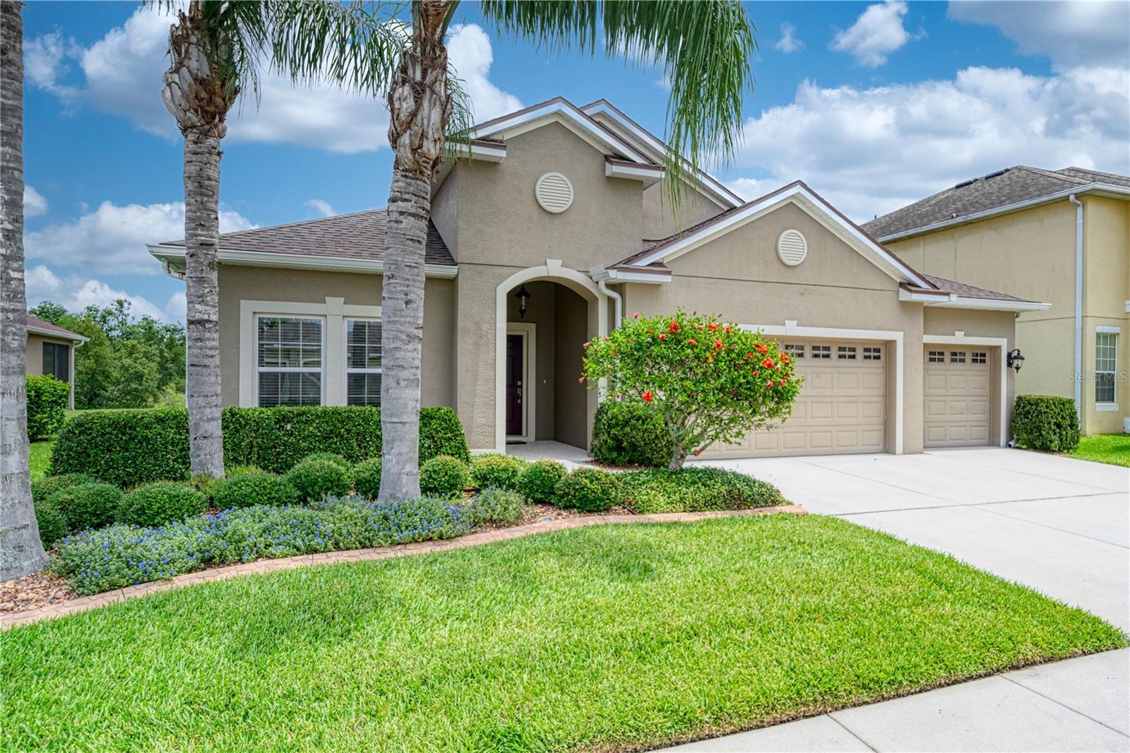 A 3-car garage and spacious driveway perfect for hosting