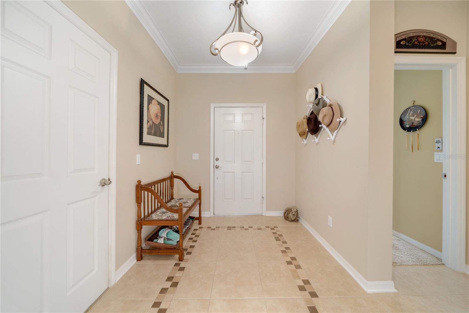 This long central hallway creates plenty of privacy between the 3-way split bedroom plan