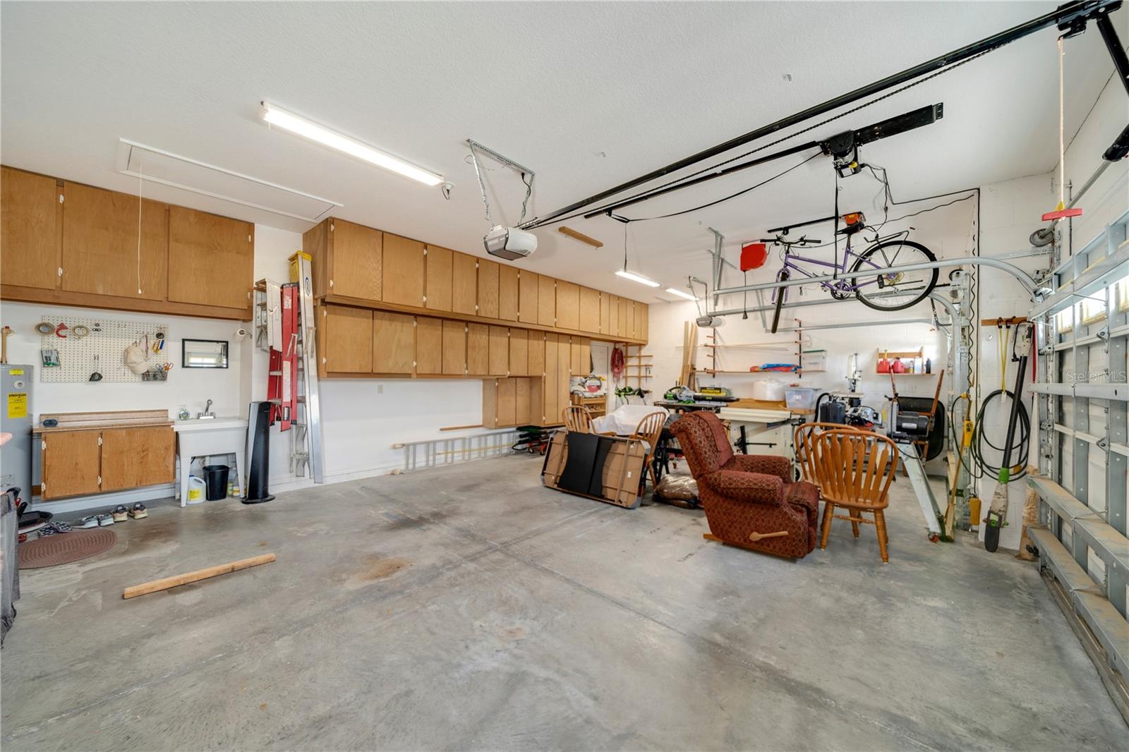 3-car garage with custom built-in cabinets