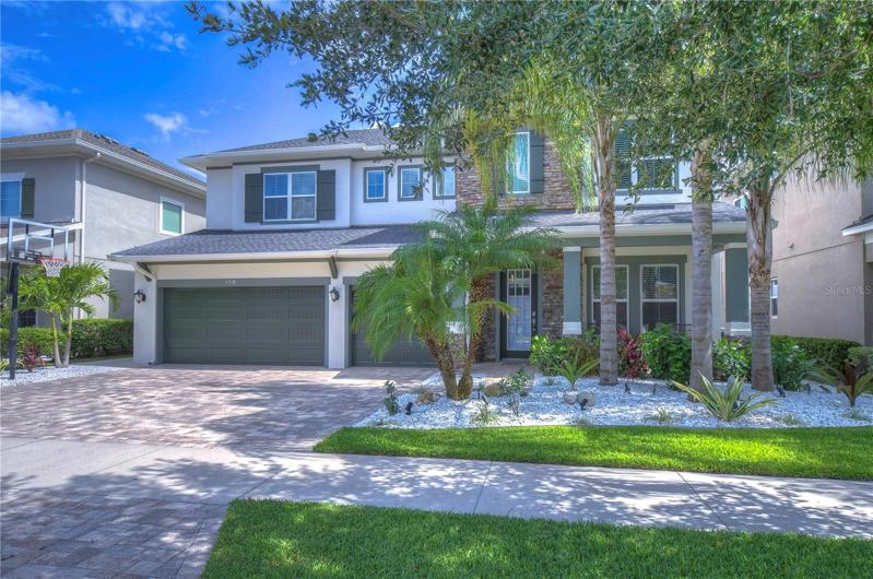 Desirable curb appeal with stacked stone accents!