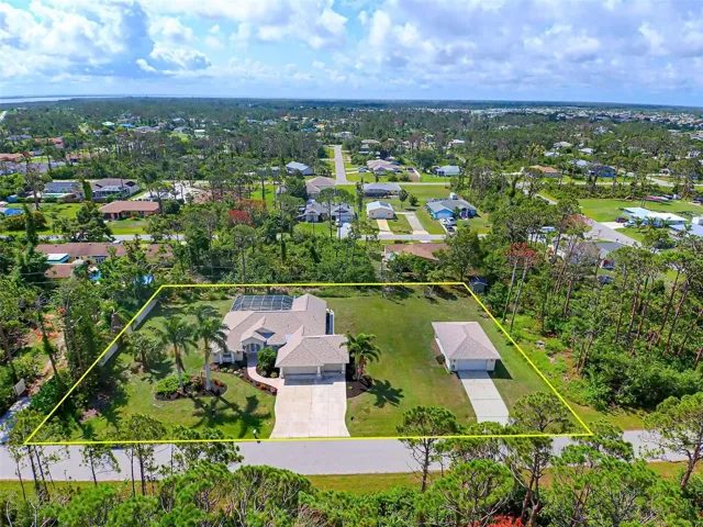Beautiful home situated on 3 lots with large detached garage/workshop