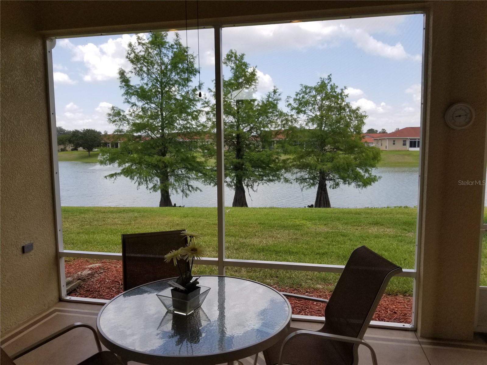 Spacious L shaped lanai with very private pond view