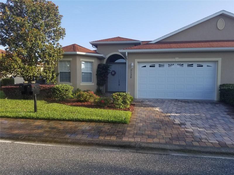 Beautiful 3/2 Block and stucco Villa 1559 S/F.2 car garage volume ceilings tile floors except bedrooms. Private full pond view.