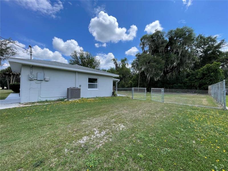 Completely Fenced Backyard with New Gate