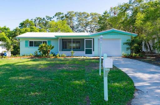 Cheerful 2 bed/2 bath single-level home with garage and breezeway!  (Sod virtually staged. Actual sod will soon be installed.)