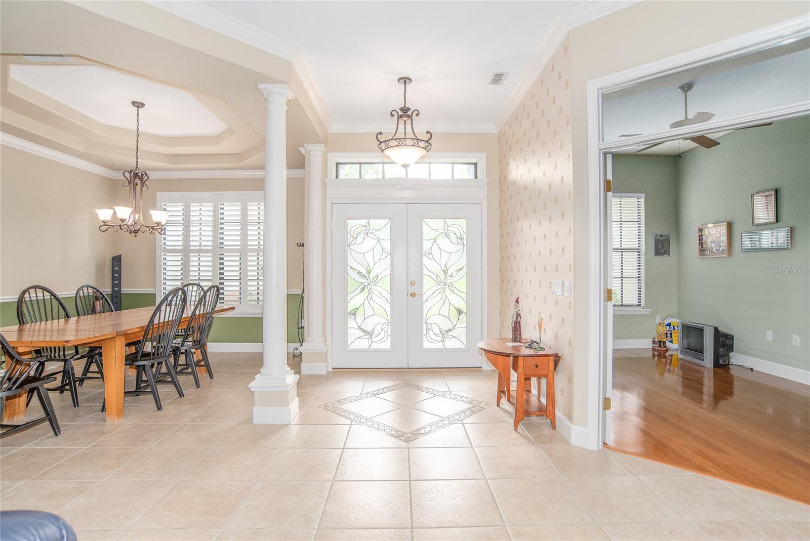 Foyer with beautiful front double doors.  Dining room and Office view