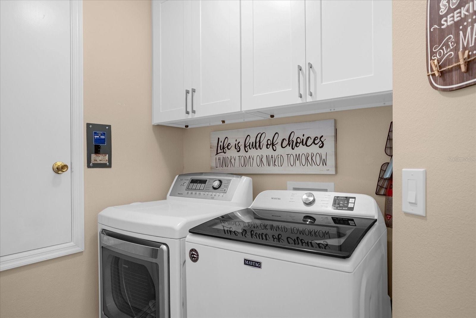 Laundry Area with new cabinets. Washer and Dryer comes with the house!