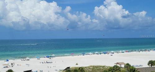birds eye view of the beach and the clear blue water