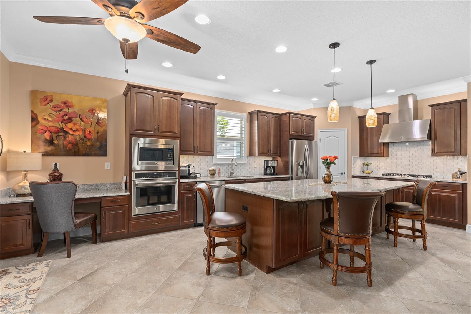 Overall View of the Extended Gourmet Kitchen. Please take notice of the Additional Cabinetry at the Front of the Island for Additional Storage.