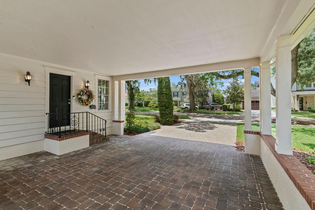 Carport and driveway for ample parking and covered entry