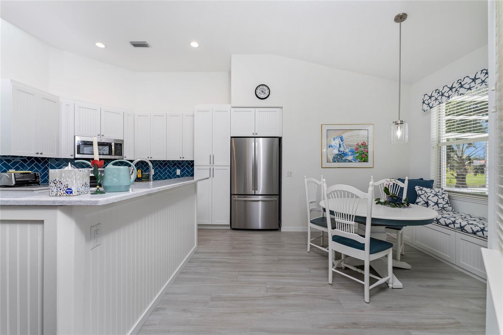Breakfast nook sports a built in window seat, providing some additional storage!