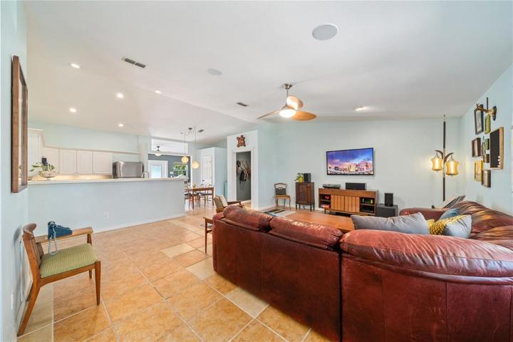 Spacious living room open to the kitchen and dining area.