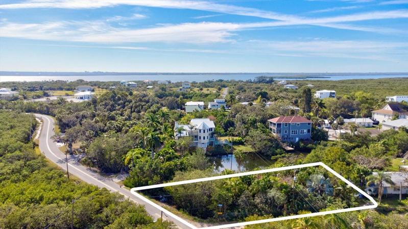 16,000+  sqft Buildable corner lot with deeded boat launch at the end of St.
