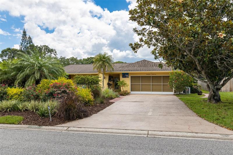 Welcome to 2121 Sarazen Dr!    A meticulously manicured and landscaped homesite in  Popular Fairway Estates!