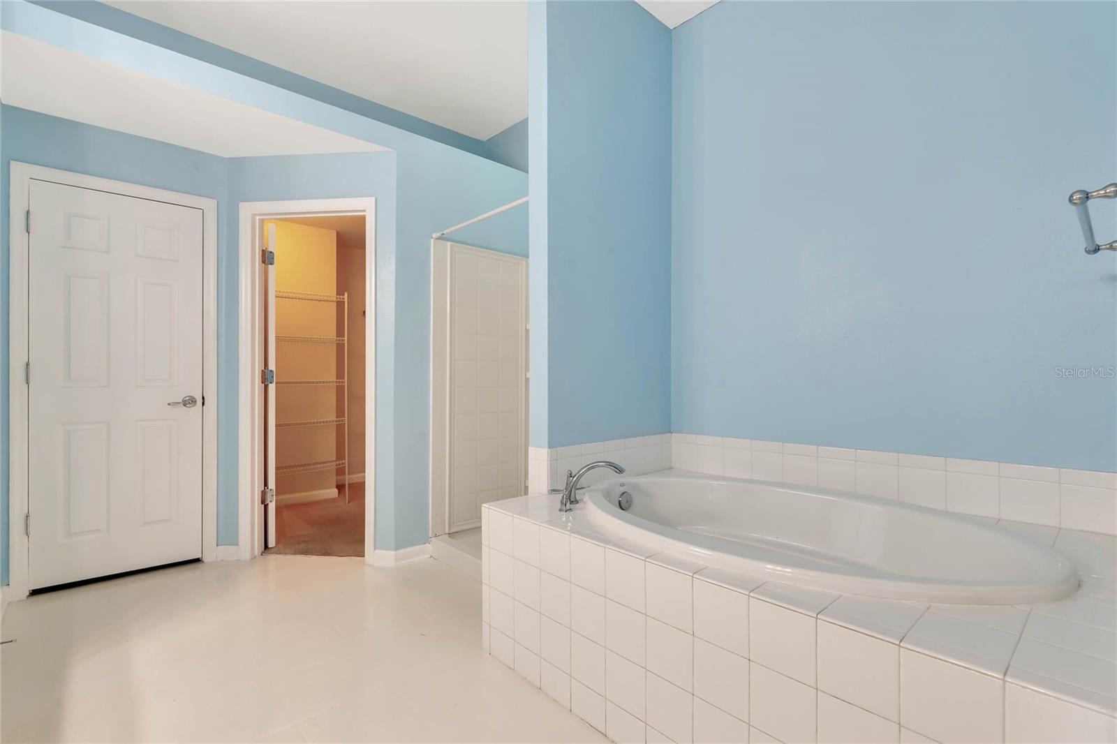 Large soaking tub in master bathroom