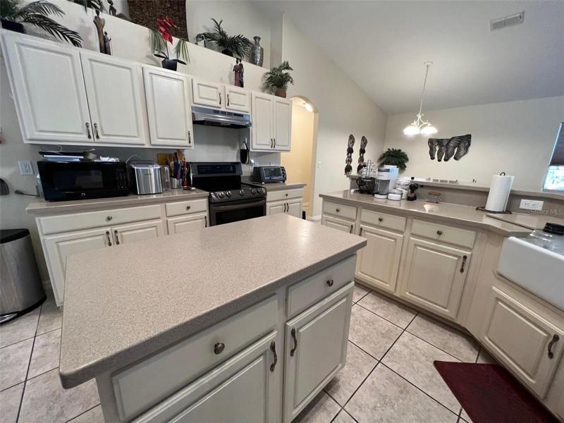 Island with drawers and cabinets - farm sink