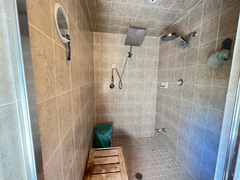 Amazing walk in shower with dual shower heads and plenty of room for a bench seat