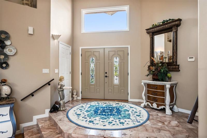 Foyer with marble stairs