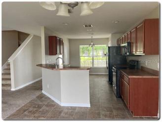 KITCHEN & STAIRS VIEW