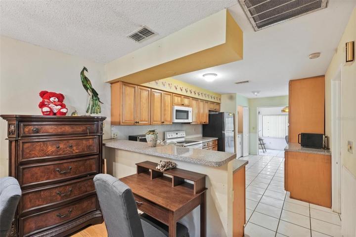 Looking into kitchen from dining/living area