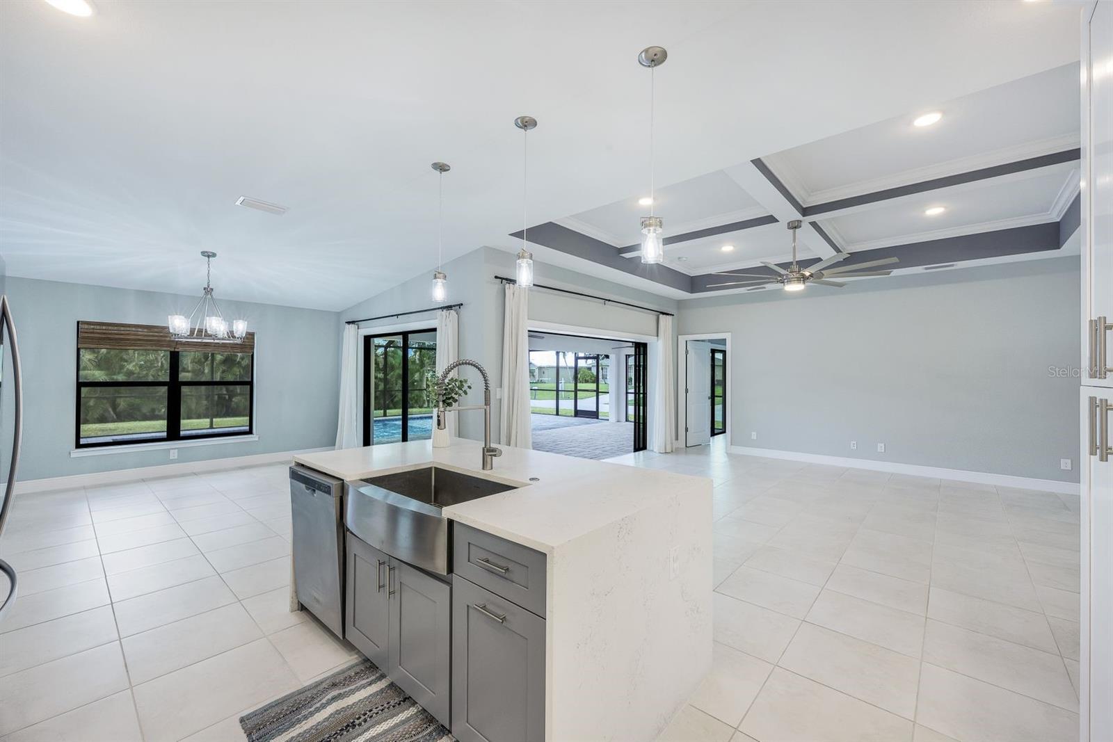 Kitchen, dining and great room have wonderful access to the Lanai/pool area