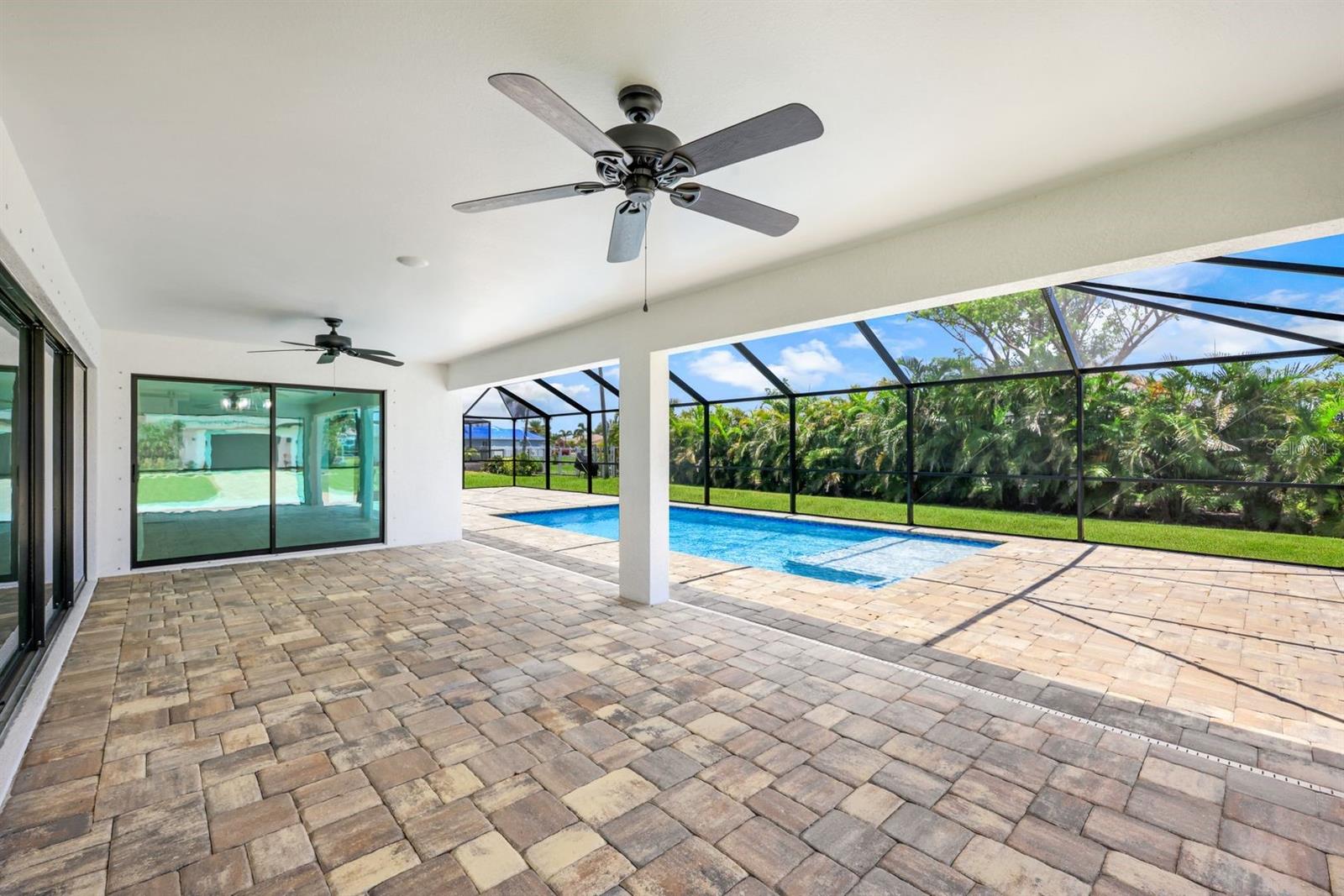 Relax or eat poolside in the shade. Lanai has access to dining, great room &amp; Owner's suite.