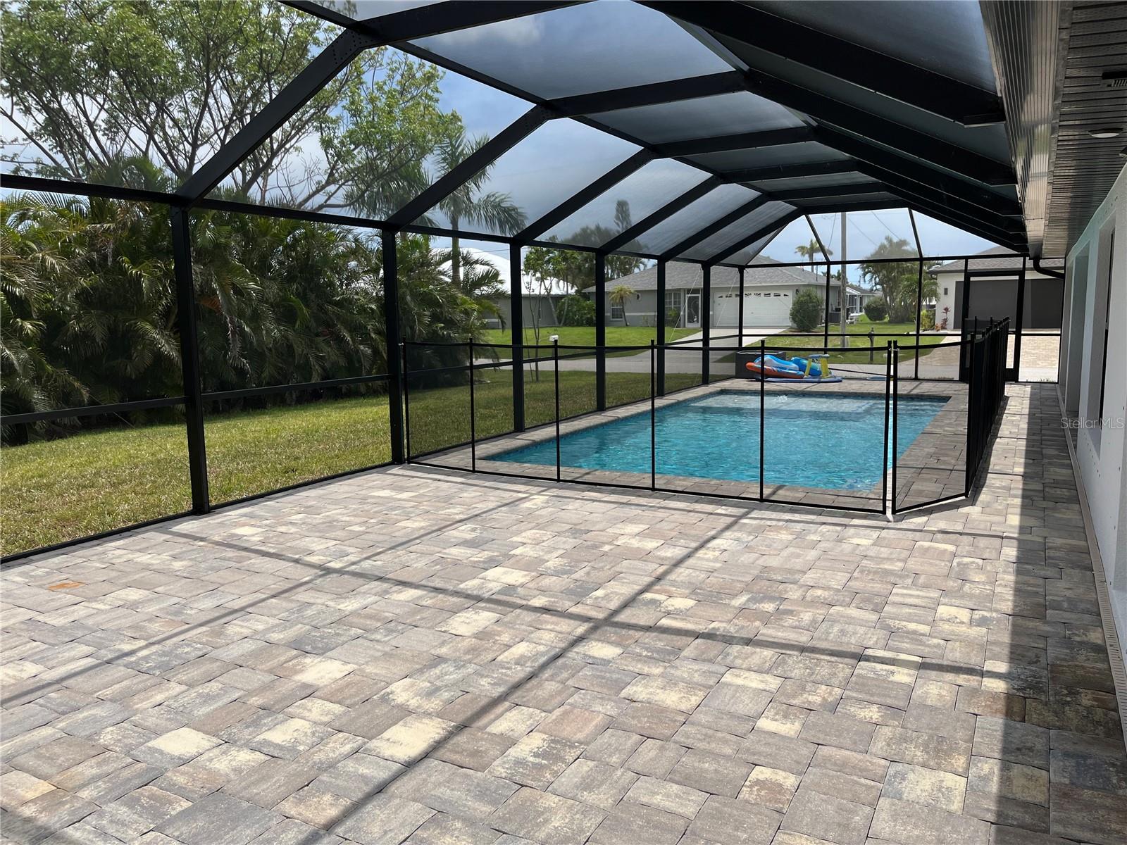 Great room w/triple pocket sliding doors to lanai/pool