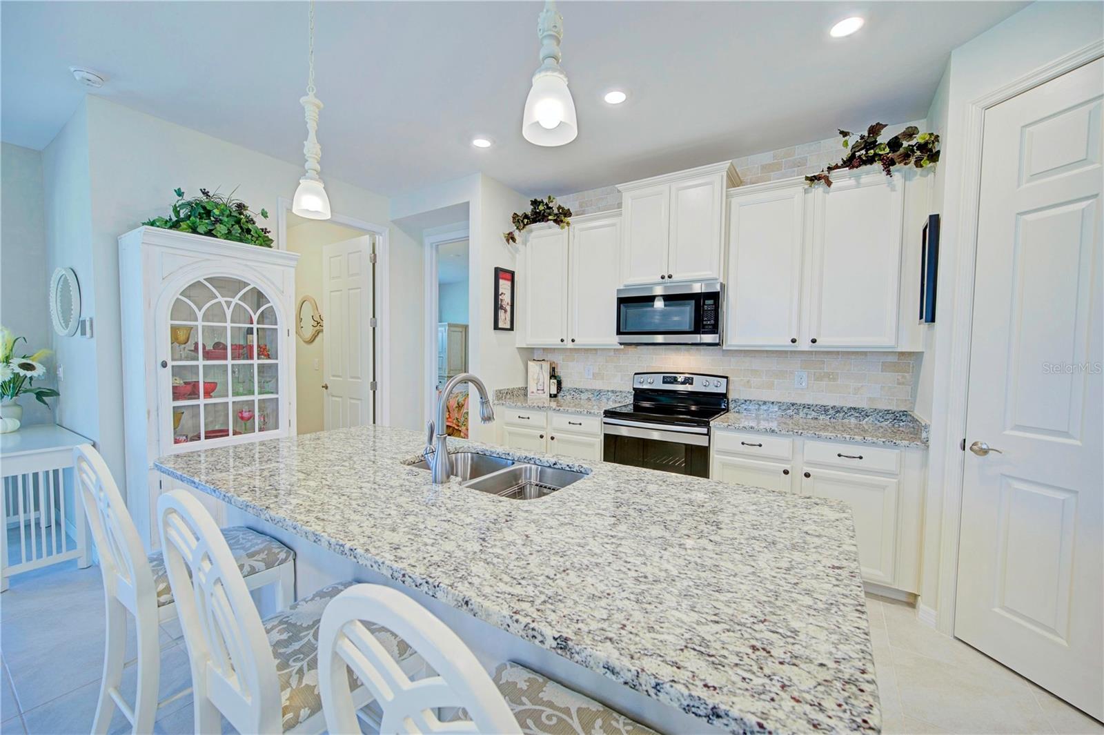 Enjoy entertaining your guests in this kitchen
