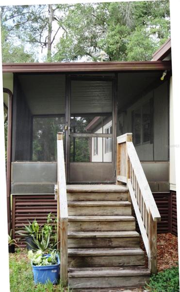 Steps to screened porch and front door; also access to home from back door with one step.