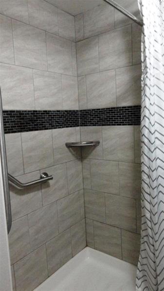 2nd bathroom with walk-in shower and safety bars
