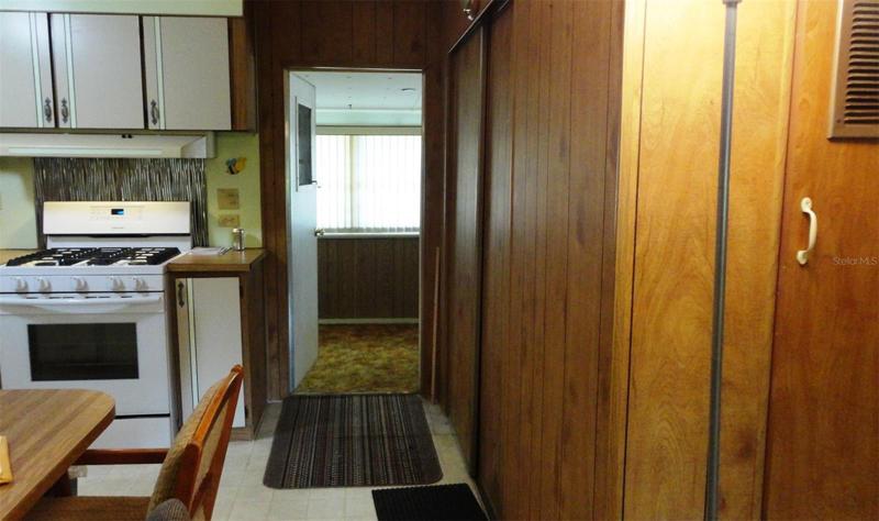 Back door of home out to the finished enclosed porch
