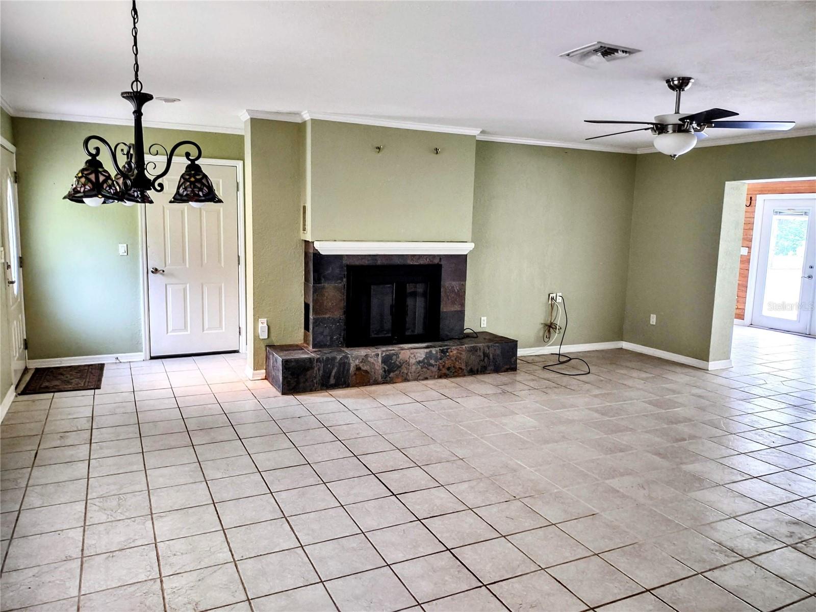 Living room and entrance with door to garage