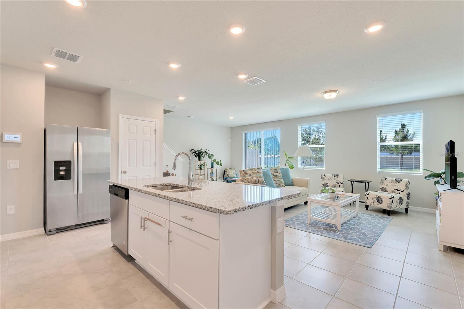 Smart features elevate this townhome to the next level, including a wi-fi-controlled front door lock, a Skybell camera doorbell, a wi-fi garage door opener, and a Honeywell Home pro series alarm system, ensuring convenience and security at your fingertips.
