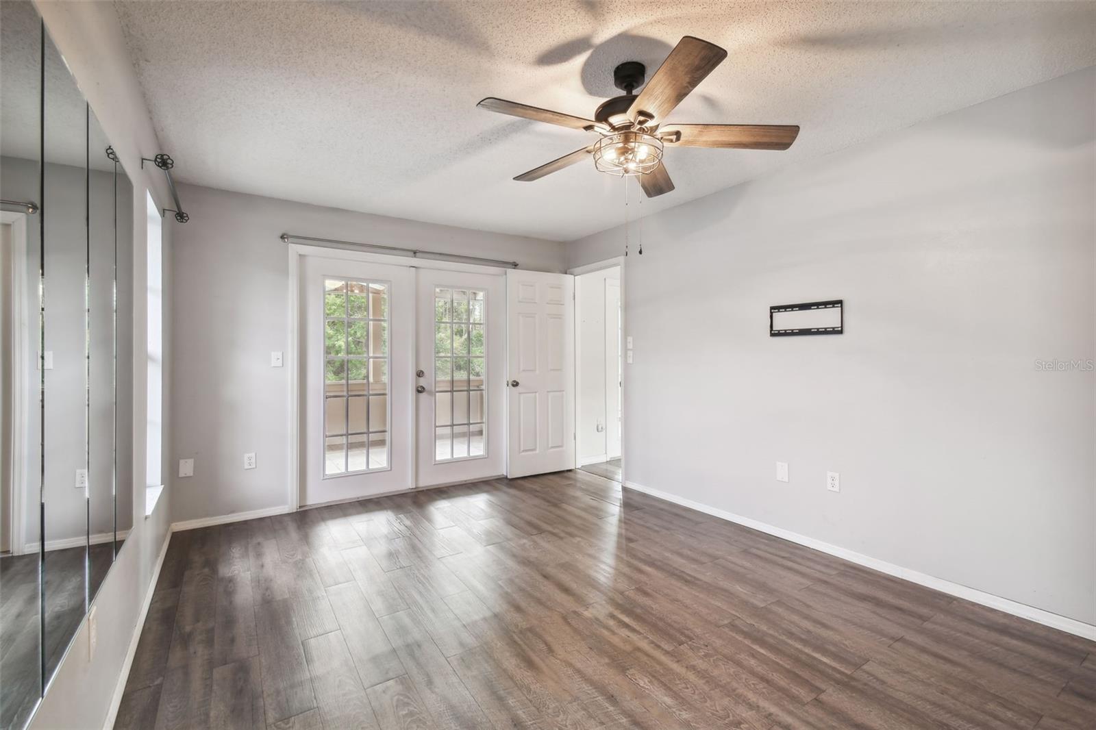 French Doors in the Master Bedroom lead out to the lanai