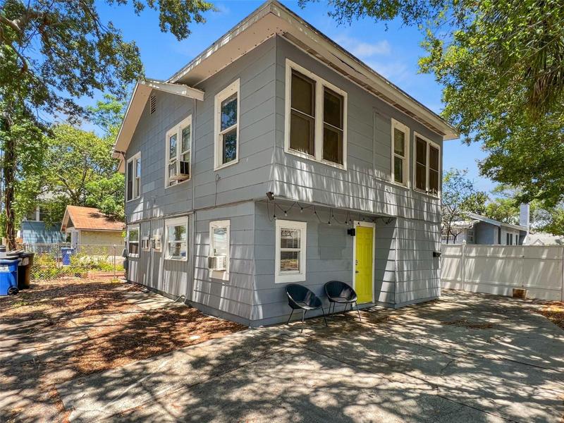 Triplex, rear building with 2 units, 1 bedroom 1 bath - bottom unit, 2 bedroom, 1 bath upper unit. Outside the fence of the single family home