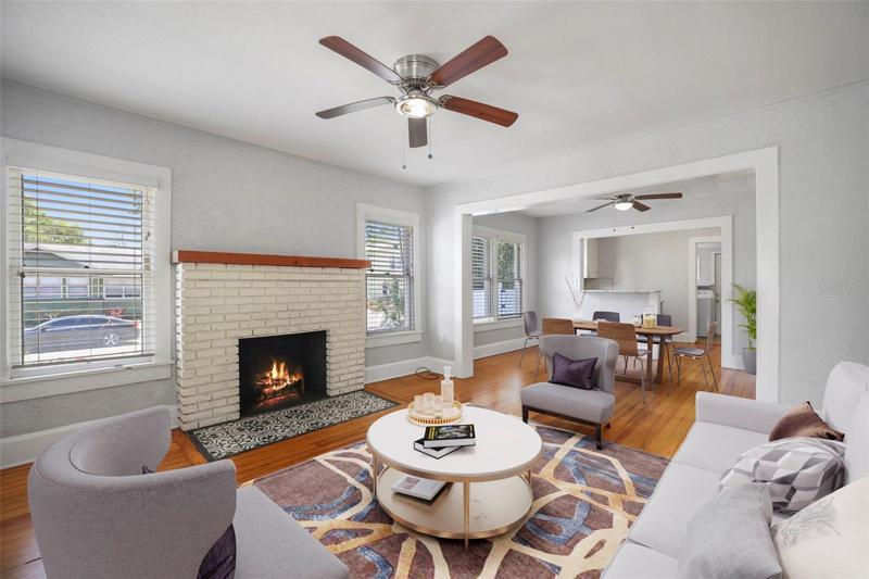 Fireplaced Living Room with beautiful Hardwood Floors. Virtually staged