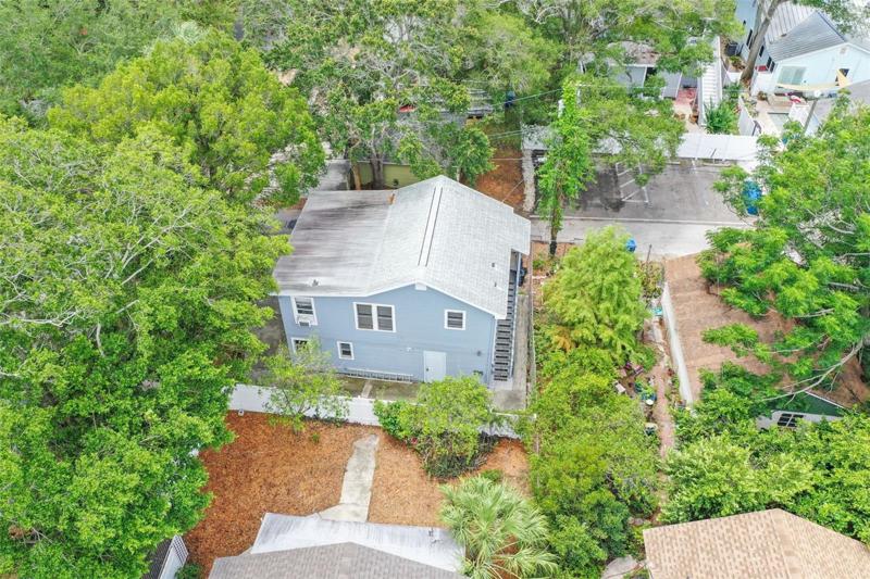 View of Building 2, Stairs on the right is the entrance to upper unit. Single Family home is at the bottom of the photo