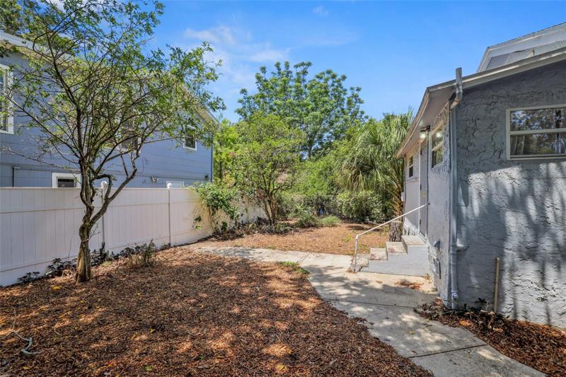 Backyard, completely fenced of single family home.