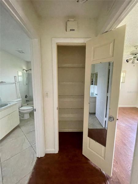 Linen closet between guest bed and bath