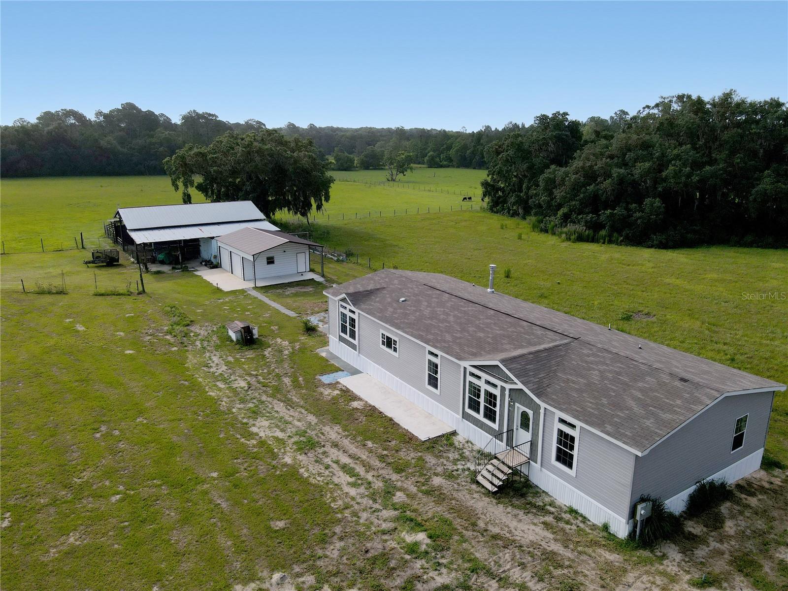 2 parcels, brand-new home, workshop and a barn-what else is there?