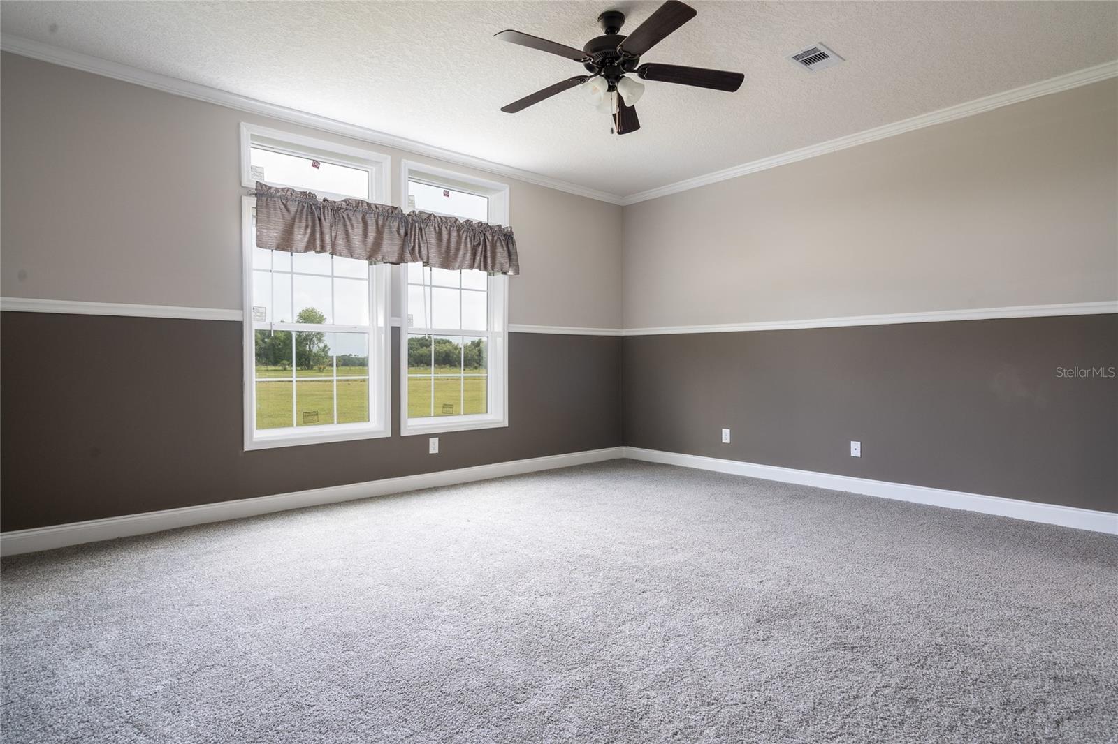 Huge Owner's Suite. Private bath and walk-in closet at right.