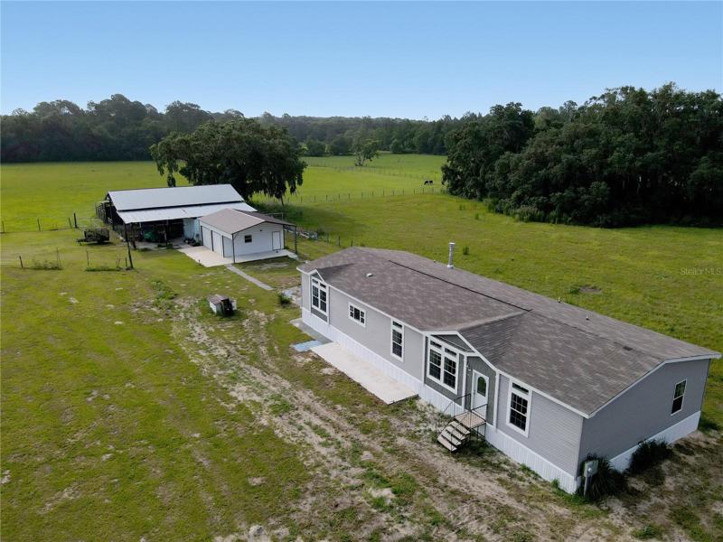 2 parcels, brand-new home, workshop and a barn-what else is there?