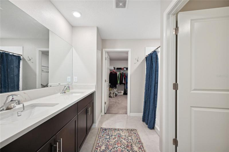 Primary bathroom with large walk-in closet