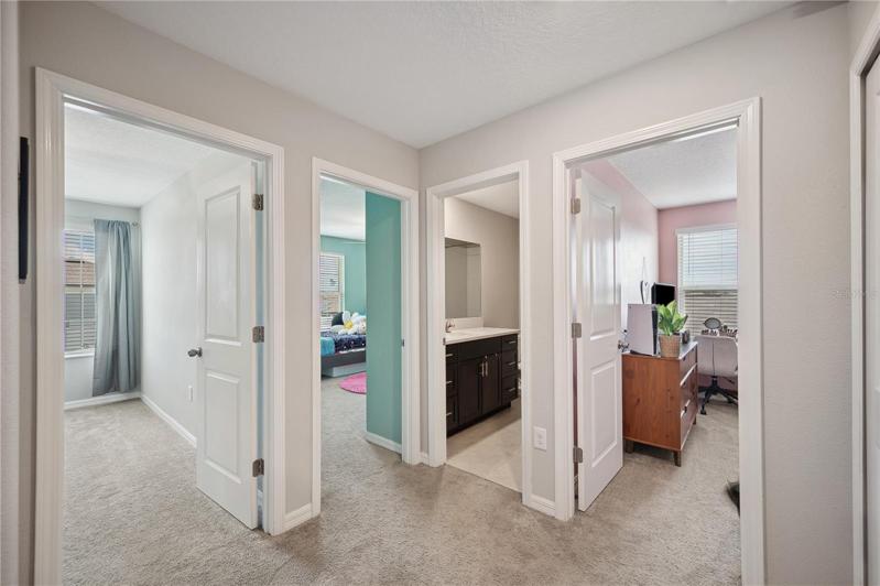 Upstairs hallway to additional 3 bedrooms