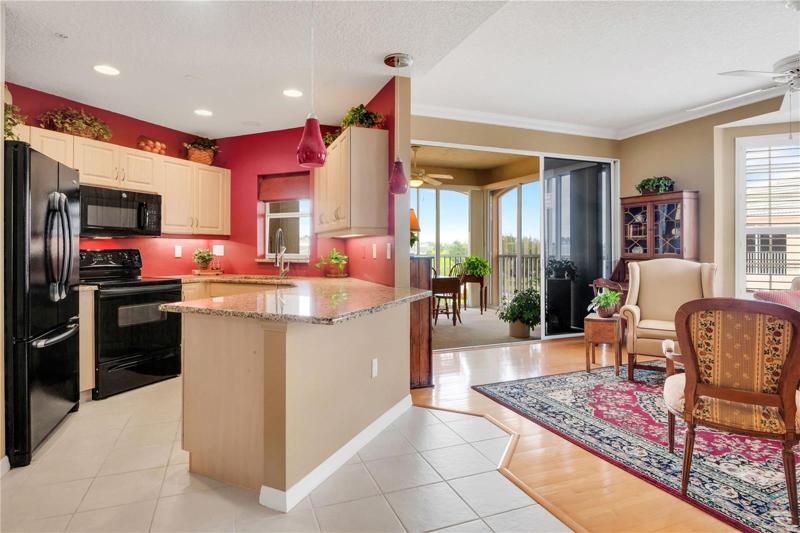 Standing in dinette area you see the kitchen, living room and Florida room