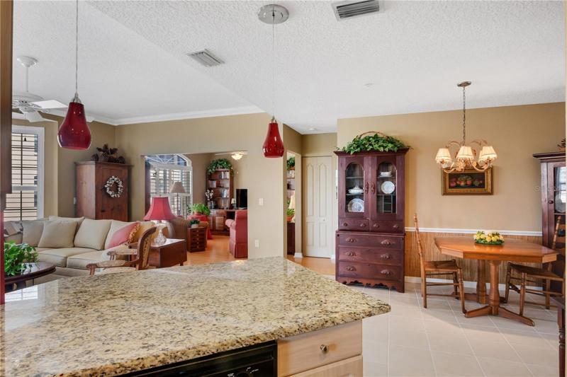 Looking out from the kitchen you see the dinette, living room and den
