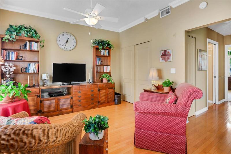The third bedroom that has been opened up as a den. To the right is the hallway leading to the second bedroom and bathroom.